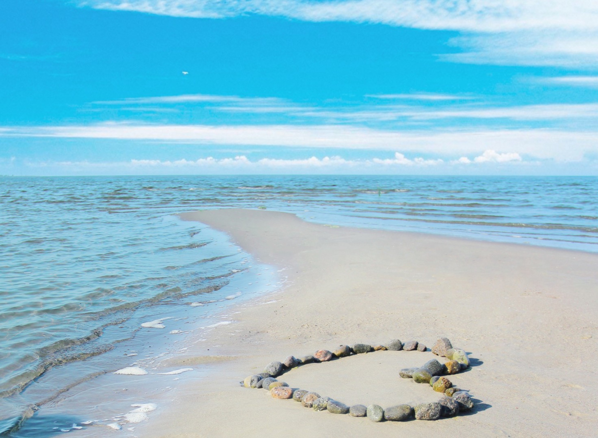 Heart Of Pebbles On Beach wallpaper 1920x1408