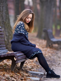 Обои Beautiful Girl Sitting On Bench In Autumn Park 240x320