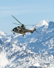 Helicopter Over Snowy Mountains wallpaper 176x220