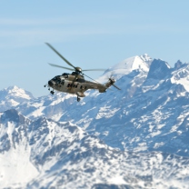 Helicopter Over Snowy Mountains wallpaper 208x208
