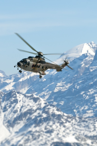Sfondi Helicopter Over Snowy Mountains 320x480