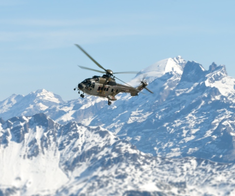 Helicopter Over Snowy Mountains wallpaper 480x400