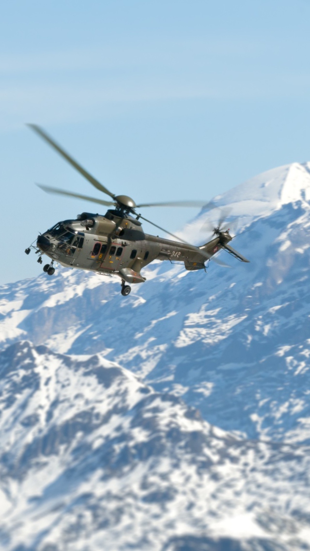 Helicopter Over Snowy Mountains wallpaper 640x1136