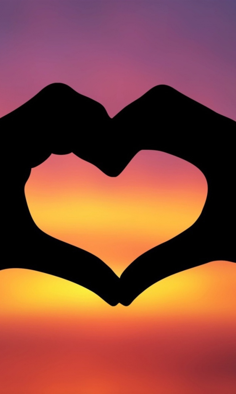 Sfondi Hands Making A Heart In The Sunset 768x1280
