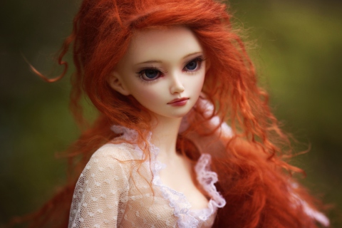 Gorgeous Redhead Doll With Sad Eyes wallpaper 480x320