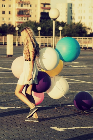 Happy Girl With Colorful Balloons wallpaper 320x480