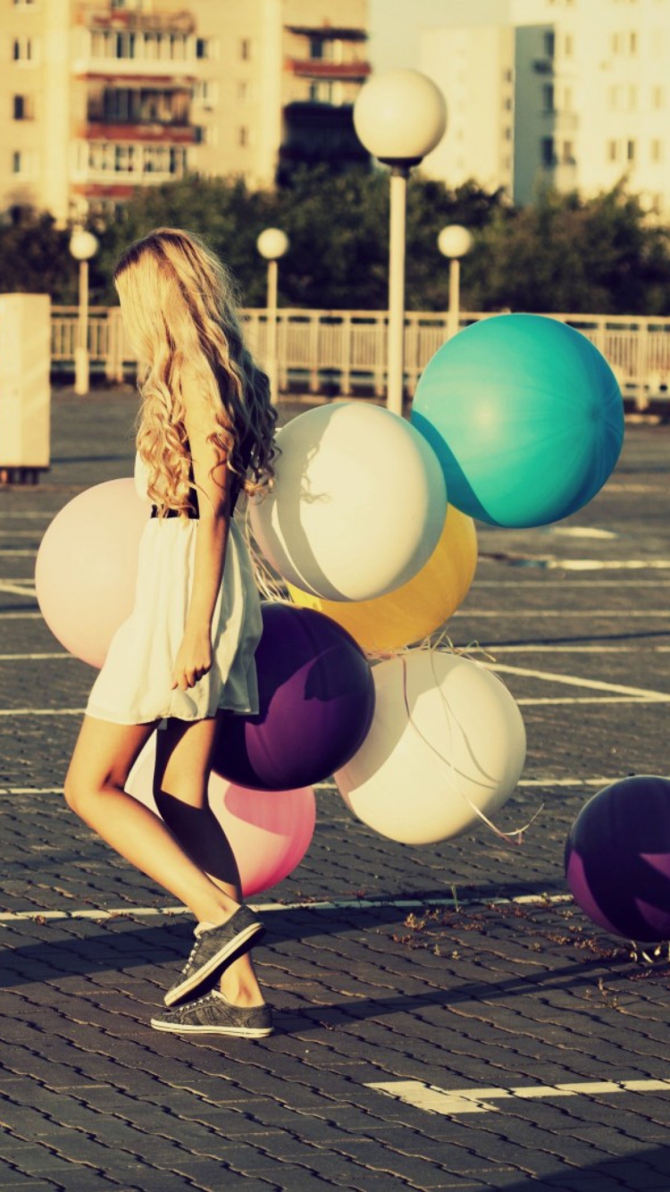 Happy Girl With Colorful Balloons wallpaper 750x1334