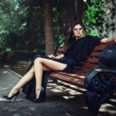 Обои Brunette model posing on bench 128x128