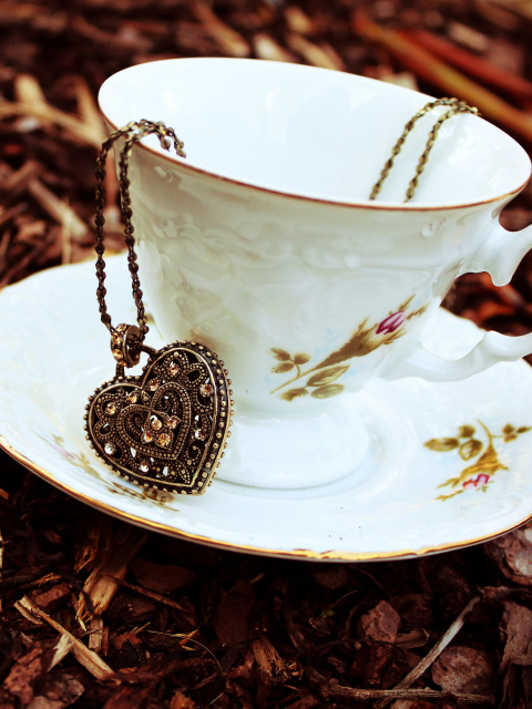 Das Heart Pendant And Vintage Cup Wallpaper 480x640