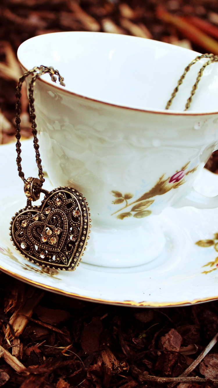 Heart Pendant And Vintage Cup wallpaper 750x1334