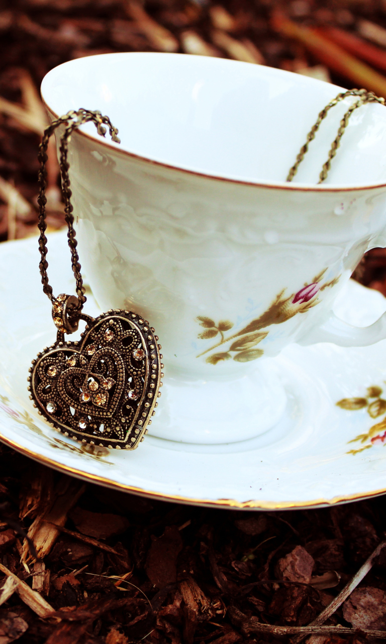Heart Pendant And Vintage Cup wallpaper 768x1280