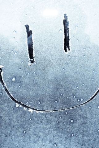 Smiley Face On Frozen Window wallpaper 320x480