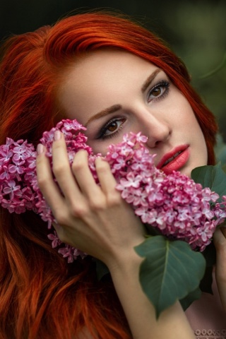 Girl in lilac flowers wallpaper 320x480