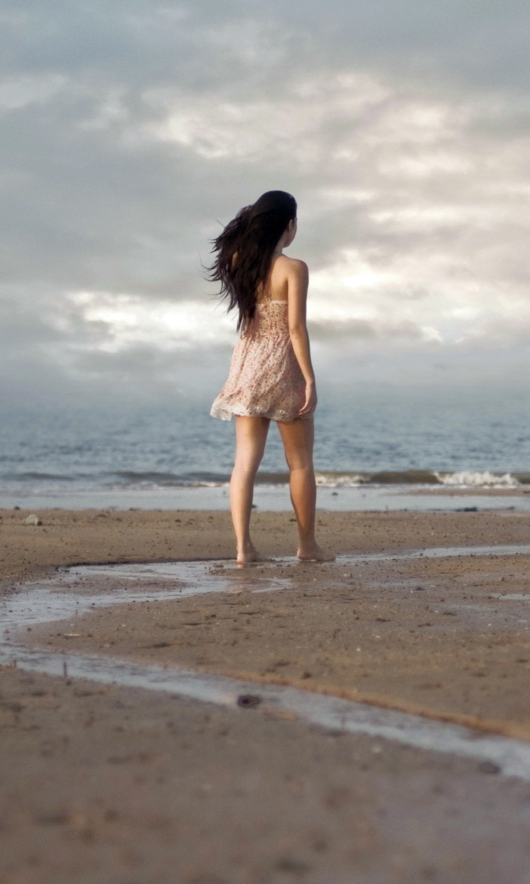 Обои Girl Walking On Beach 768x1280