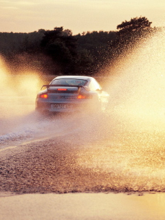 Fondo de pantalla Porsche GT2 In Water Splashes 240x320
