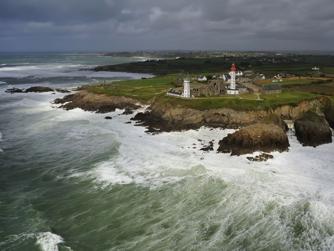 Lighthouse On Hill And Big Waves wallpaper 1152x864