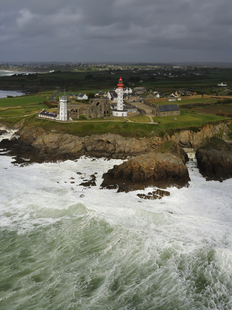 Lighthouse On Hill And Big Waves wallpaper 480x640