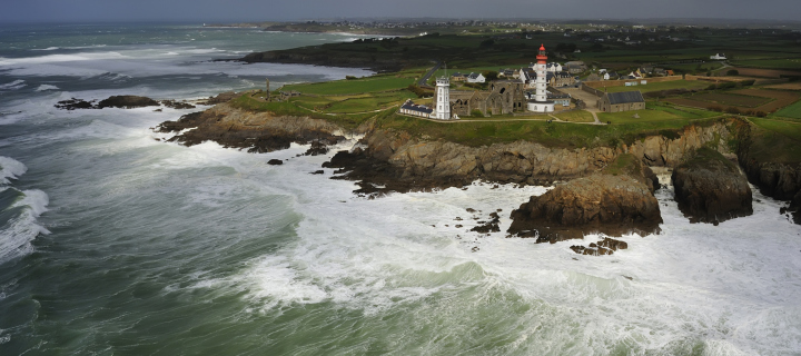 Lighthouse On Hill And Big Waves wallpaper 720x320