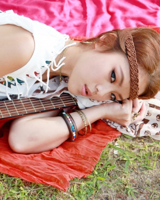 Kostenloses Girl with Guitar Wallpaper für Nokia X1-00