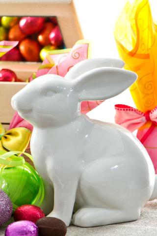 Обои Porcelain Easter hares 320x480