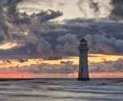 Massive Clouds Above Lighthouse wallpaper 176x144