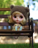 Das Doll Sitting On Bench Wallpaper 128x160