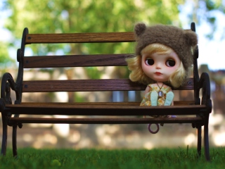 Doll Sitting On Bench wallpaper 320x240