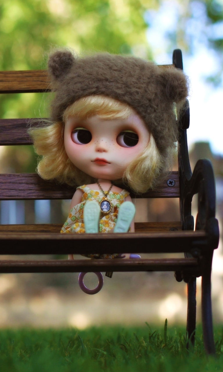 Das Doll Sitting On Bench Wallpaper 768x1280