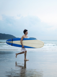 Guy Running With Surf Board wallpaper 240x320