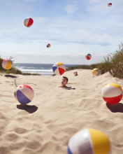Fondo de pantalla Beach Balls And Man's Head In Sand 176x220