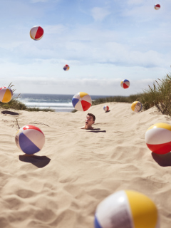 Fondo de pantalla Beach Balls And Man's Head In Sand 240x320