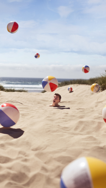 Fondo de pantalla Beach Balls And Man's Head In Sand 360x640