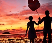 Couple With Balloons Silhouette At Sunset wallpaper 176x144