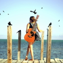 Girl With Guitar On Sea wallpaper 128x128