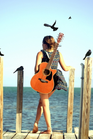 Girl With Guitar On Sea wallpaper 320x480