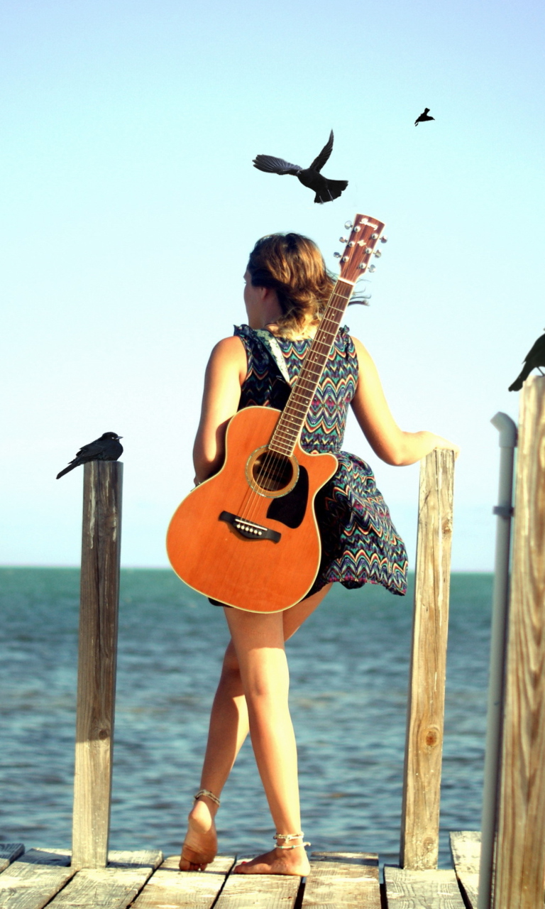 Girl With Guitar On Sea wallpaper 768x1280