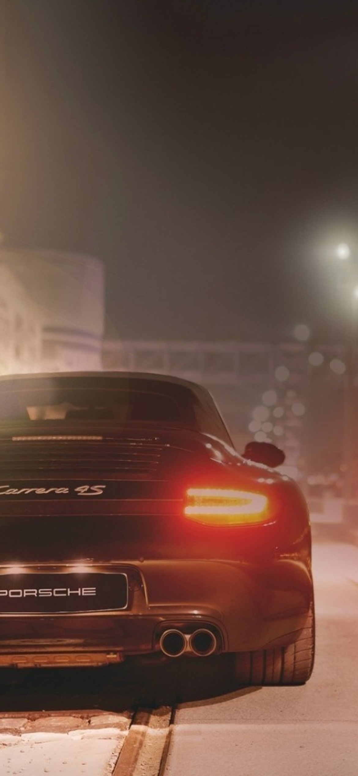 Black Porsche Carrera At Night wallpaper 1170x2532