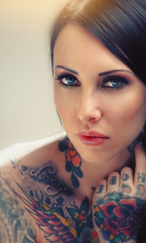 Blue Eyed Tattooed Brunette wallpaper 480x800