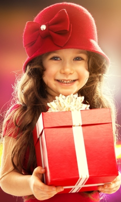 Happy Child With Present wallpaper 240x400