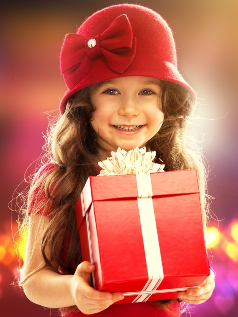 Happy Child With Present wallpaper 480x640