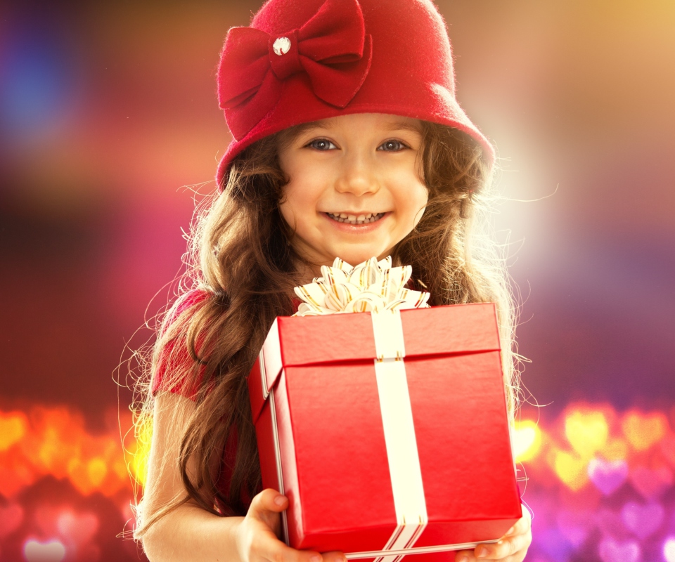 Happy Child With Present wallpaper 960x800