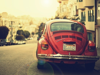 Vintage Red Volkswagen Beetle wallpaper 320x240