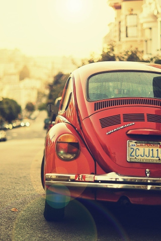 Vintage Red Volkswagen Beetle wallpaper 320x480