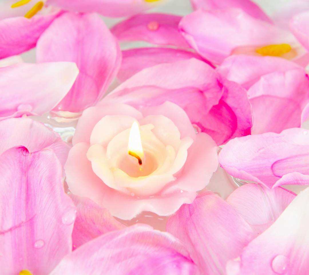 Candle on lotus petals wallpaper 1080x960