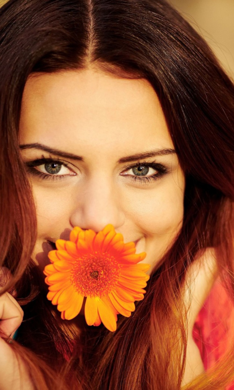 Обои Brunette Cutie With Orange Daisy 768x1280