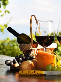 Picnic with wine and grapes wallpaper 240x320