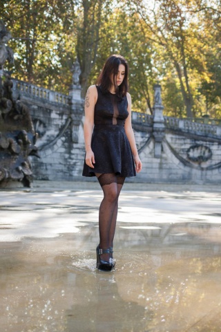 Stockings brunette in puddle wallpaper 320x480