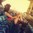 Sfondi Girl Sitting In Stadium 128x128