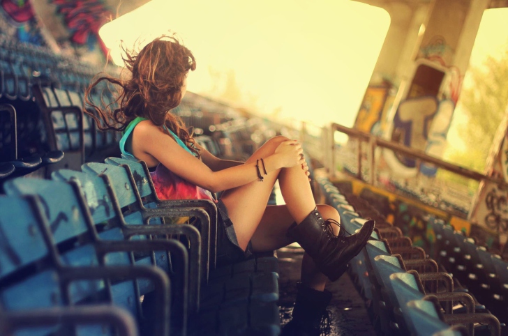 Girl Sitting In Stadium wallpaper