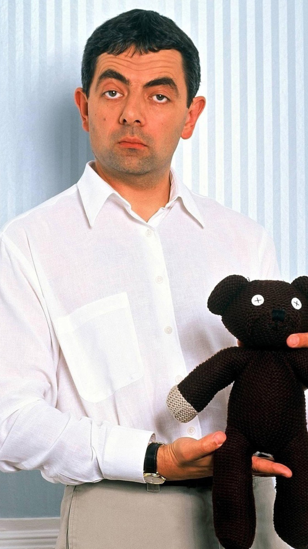 Mr Bean with Knitted Brown Teddy Bear wallpaper 1080x1920